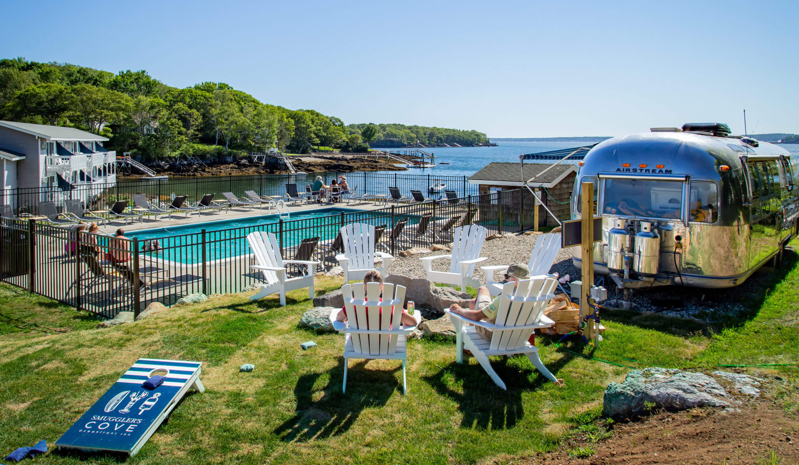 The fire pit area and pool at one of the best places to stay in the Boothbay Harbor region.